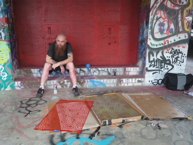 Logan Hicks waiting for paint to dry